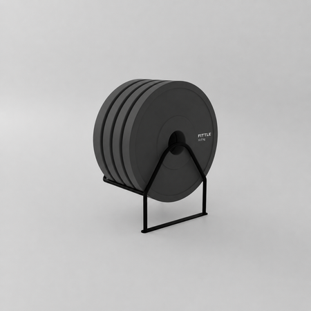 Set of four 10kg Fittle weight plates on a minimalist storage stand for home strength training.