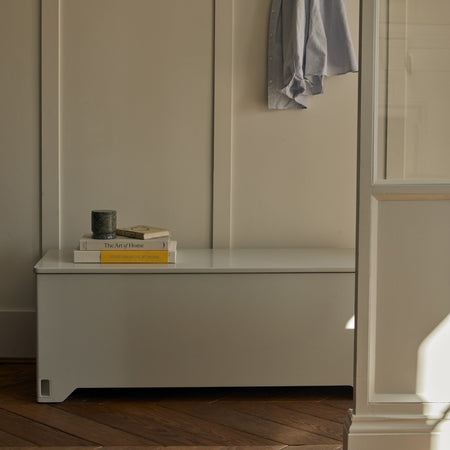Soft Grey Fittle Box styled in a hallway as a discreet home strength training storage bench.