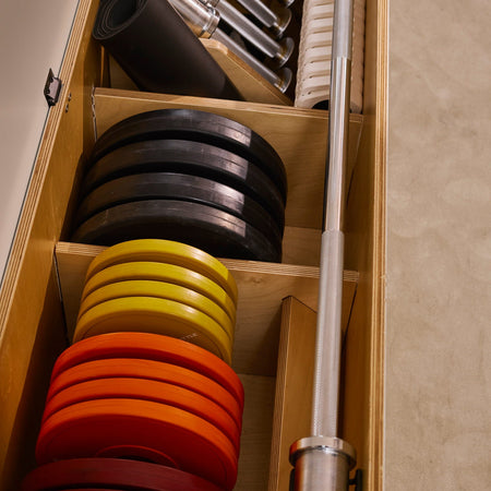 A max pack with four 10kg plates installed inside a soft grey Fittle Box. 
