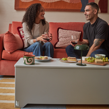 Fittle Box closed and styled as a modern coffee table in living room, discreet home fitness storage bench blending seamlessly with contemporary interior design
