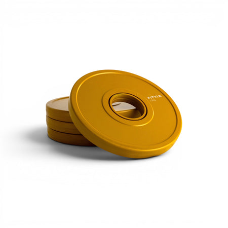 4 yellow weight plates on a white background.