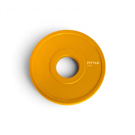 Yellow Fittle weight plate with branding on a white background