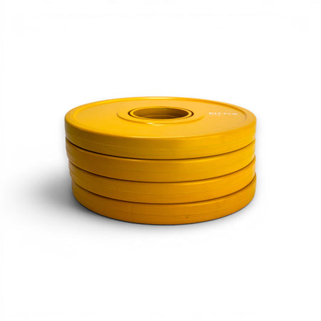 4 yellow Fittle weight plates with branding on a white background