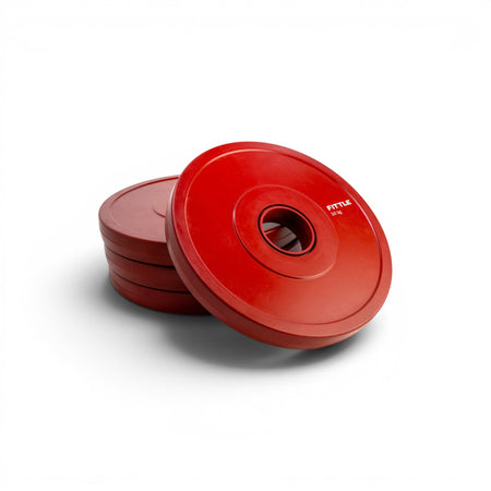 4 red weight plates on a white background